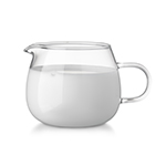 Glass glass creamer full of fresh cream isolated on white